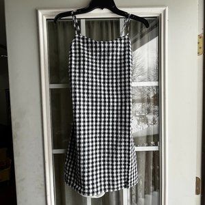 A tags still attached black and white size small never been worn short dress.